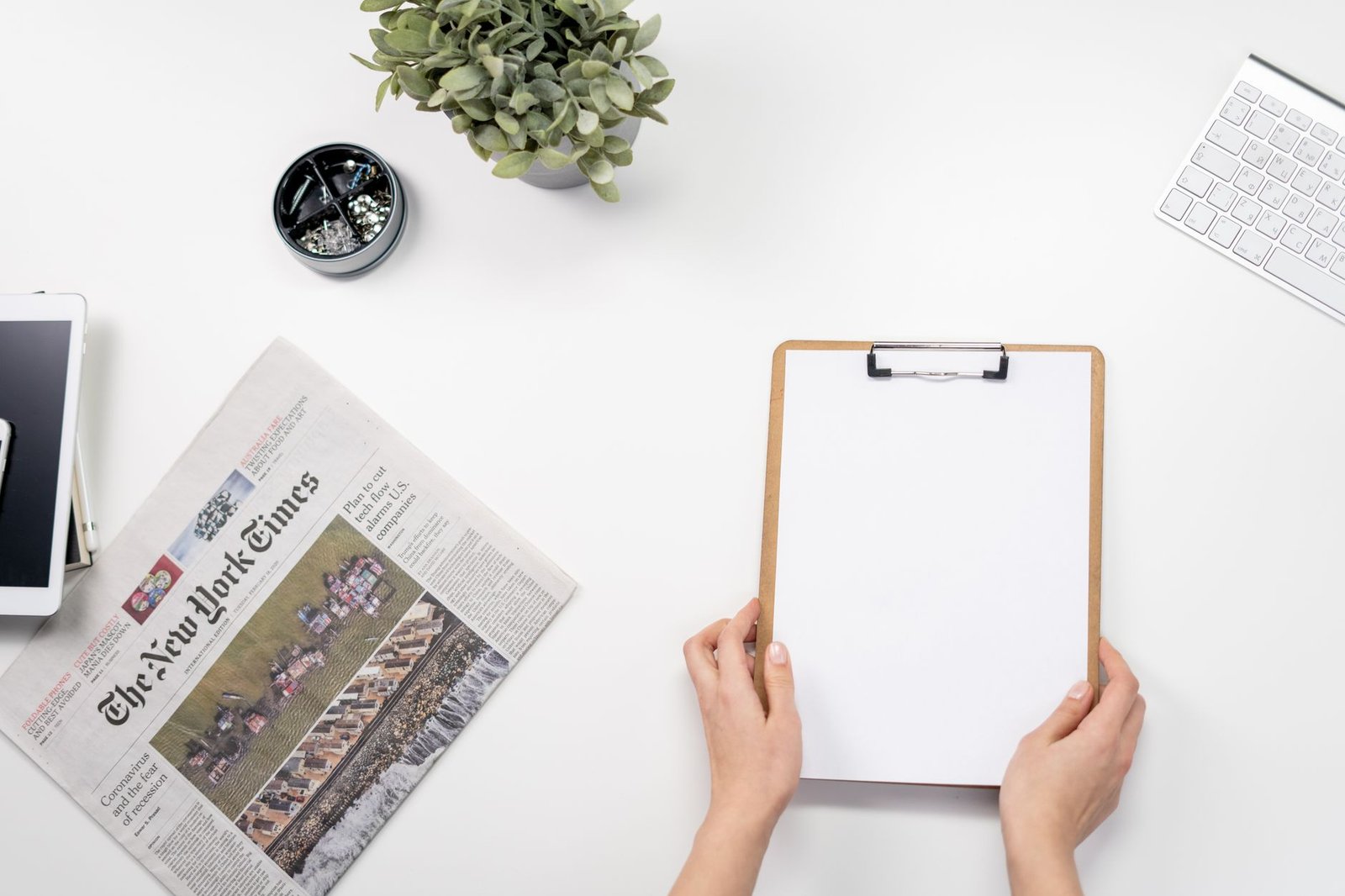 Flat lay of a home office desk with a clipboard, newspaper, and accessories. — Trueluck Casino: Epic Games and High Bonus Pot